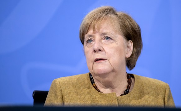 epa08920954 German Chancellor Angela Merkel during a press conference after a coronavirus update meeting with the German state premiers, in Berlin, Germany, 05 January 2021. Germany is to extend its n ...