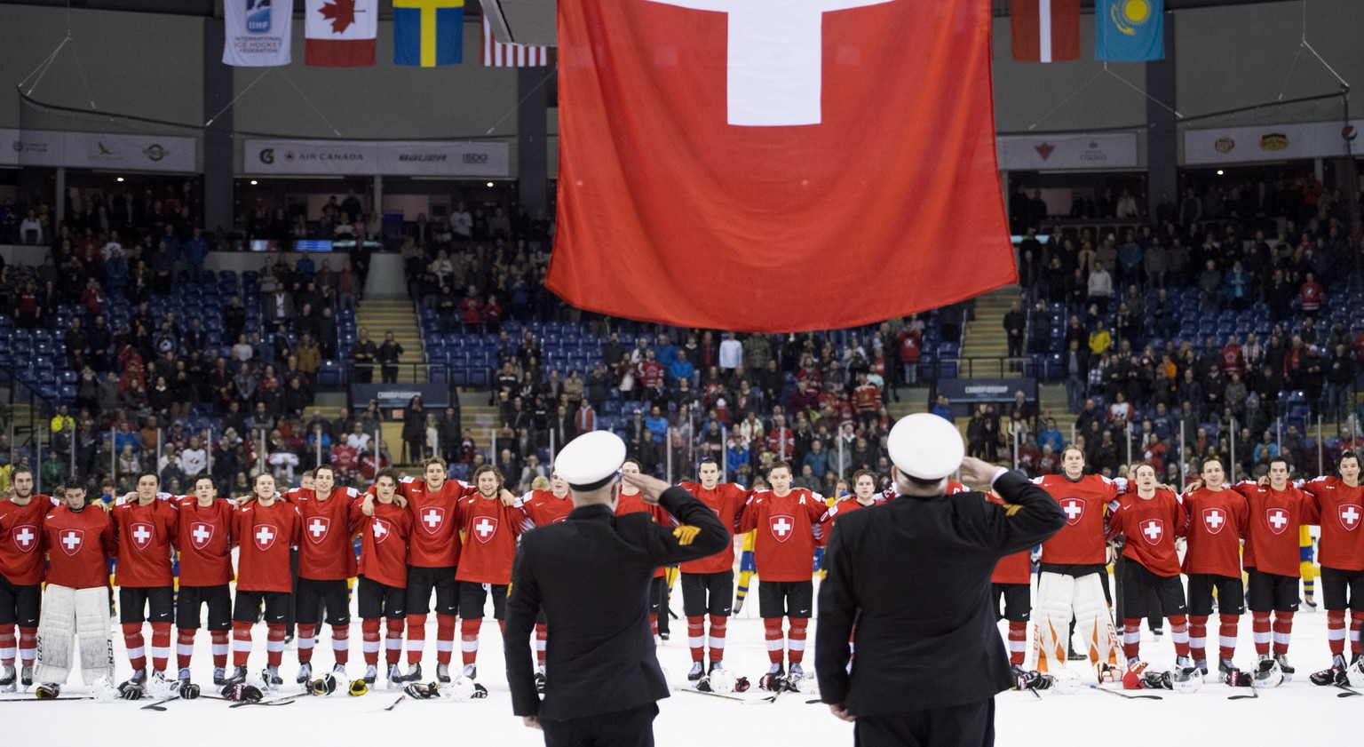 Switzerland players gather after a win over Sweden in a quarterfinal of the world junior hockey championships, Wednesday, Jan. 2, 2019, in Victoria, British Columbia. (Jonathan Hayward/The Canadian Pr ...