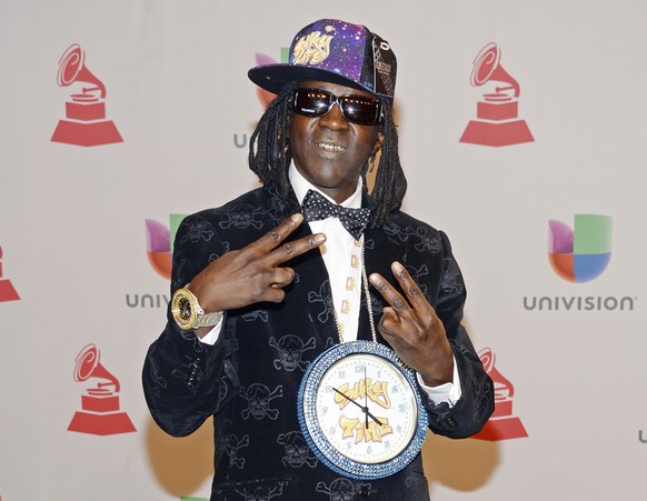 FILE - This Nov. 20, 2014 file photo shows rapper Flavor Flav, whose real name is William Jonathan Drayton Jr., at the 15th annual Latin Grammy Awards in Las Vegas. Police in Las Vegas say Ugandi Howa ...