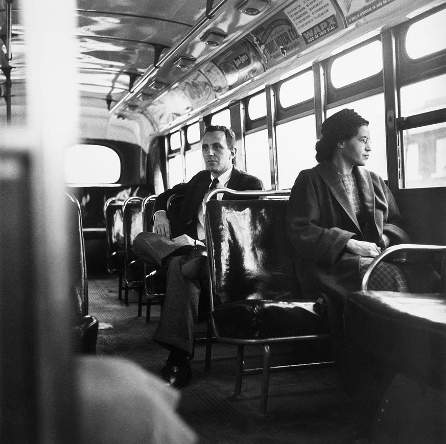 Rosa Parks sits in the front of a bus in Montgomery, Alabama, after the Supreme Court ruled segregation illegal on the city bus system on December 21st, 1956. Parks was arrested on December 1, 1955 fo ...