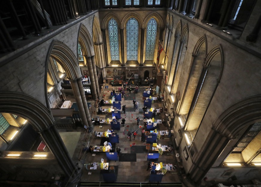 Fourteen tables are set up to provide the Pfizer-BioNTech vaccine inside Salisbury Cathedral in Salisbury, England, Wednesday, Jan. 20, 2021. Salisbury Cathedral opened its doors for the second time a ...