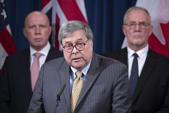 epa08272887 US Attorney General William Barr (C) delivers remarks in front of Minister for Home Affairs of Australia Peter Dutton (L) and Canadian Minister of Public Safety and Emergency Preparedness  ...