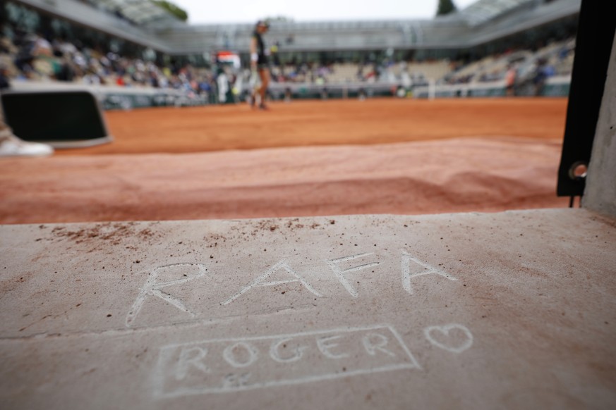 A tennis fan left his marks &quot;RAFA&quot; for Spain&#039;s Rafael Nadal and &quot;ROGER&quot; for Switzerland&#039;s Roger Federer on Simonne Mathieu court during a women&#039;s semifinal match of  ...