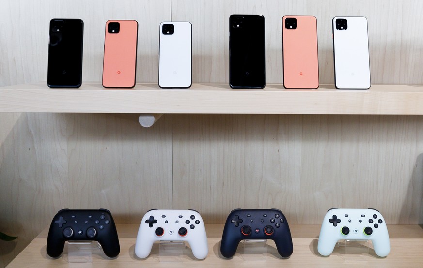 epa07922946 A display of the new Google Pixel 4 phones (top) and the Google Stadia cloud-based gaming system controllers, during a Google product launch event called &#039;Made by Google &#039;19&#039 ...