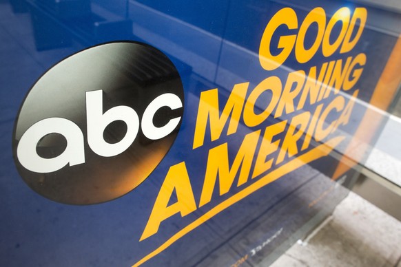 FILE - This Wednesday, May 10, 2017, file photo shows the ABC logo, a Disney brand, in an advertisement at a bus stop near their television studio on the West Side of Manhattan, in New York. The Walt  ...