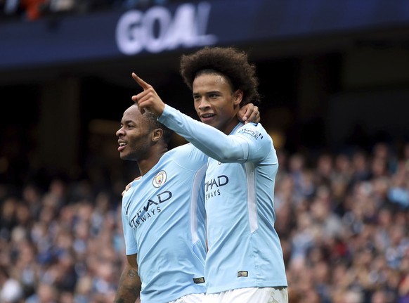 Manchester City&#039;s Raheem Sterling, left, celebrates scoring his side&#039;s second goal of the game with teammate Leroy Sane, during the English Premier League soccer match between Manchester Cit ...