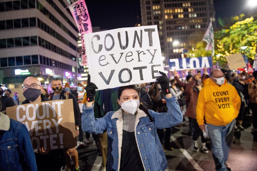 epa08799556 Demonstrators rally outside of City Hall about the 2020 Presidential election in Philadelphia, Pennsylvania, USA, 04 November, 2020. Counting of mail-in ballots in Pennsylvania began on 03 ...