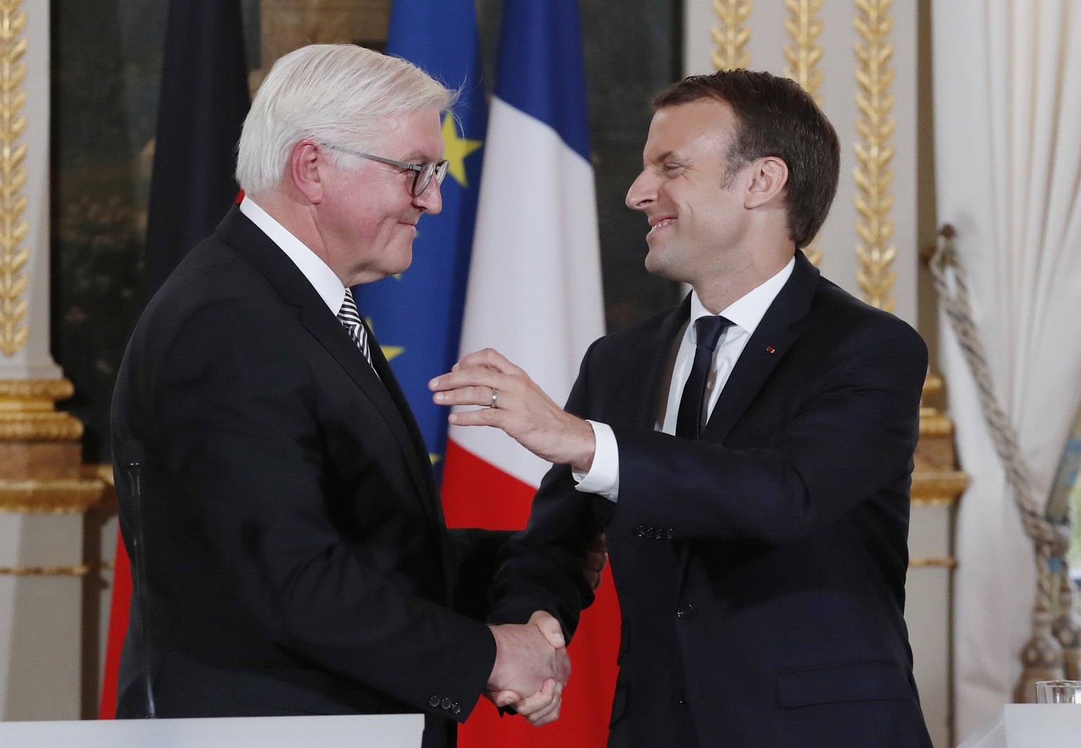 German President Frank-Walter Steinmeier, left, and French President Emmanuel Macron shake hands after a media conference at the Elysee Palace in Paris, France, Friday, Nov. 10, 2017. Frank-Walter Ste ...