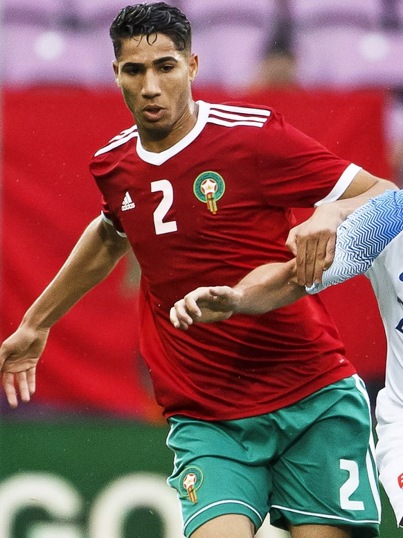 epa06785386 Morocco&#039;s defender Achraf Hakimi (L) in action against Slovakia&#039;s midfielder Robert Mak (R) during the International Friendly soccer match between Morocco and Slovakia at the Sta ...
