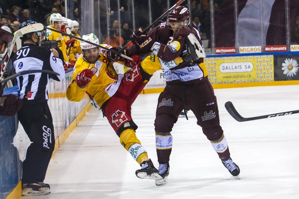 Geneve-Servette&#039;s forward Floran Douay, right, checks Tigers&#039; forward Christopher DiDomenico, of Canada, left, during a National League regular season game of the Swiss Championship between  ...