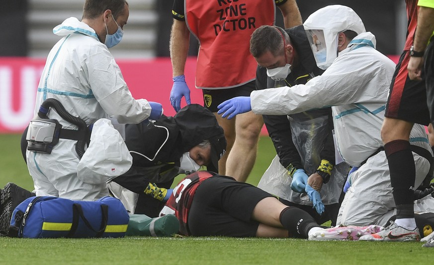 Bournemouth&#039;s Adam Smith receives medical attention during the English Premier League soccer match between Bournemouth and Tottenham at the Vitality Stadium in Bournemouth, England, Thursday, Jul ...