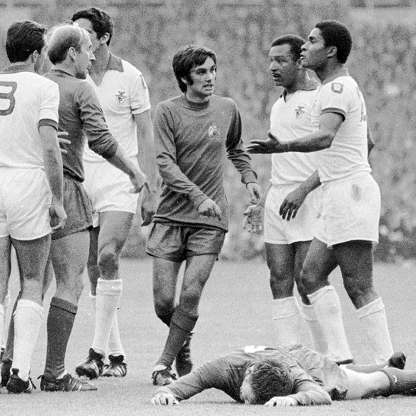 Manchester United player George Best (C) with Benfica Lisbon players, Eusebio (R) and Coluna (2nd right) during their European Champions Cup final at Wembley stadium in 1968. According to reports Thur ...