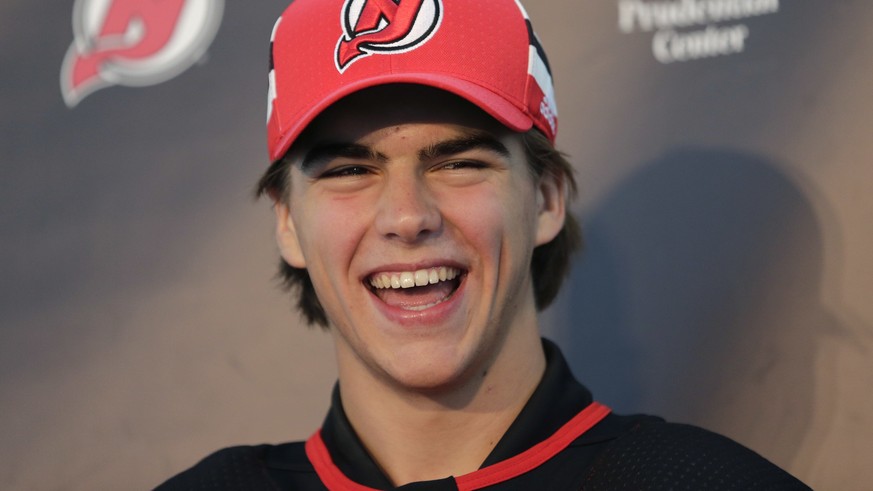 New Jersey Devils&#039; Nico Hischier laughs during a news conference in Newark, N.J., Monday, June 26, 2017. The 18-year-old center was the first Swiss-born player to be drafted first overall in the  ...