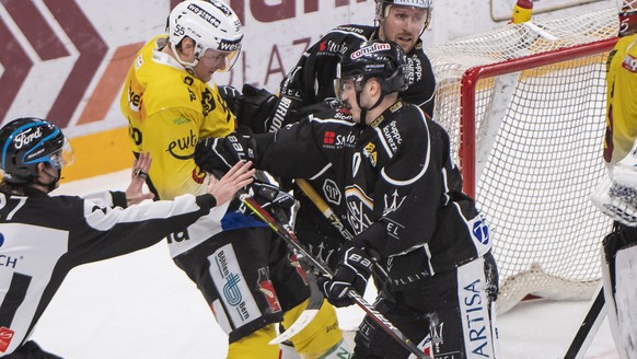 From left, Bern&#039;s player Calle Andersson, LuganoÄôs player Alessio Bertaggia and LuganoÄôs player David Mcintyre, Bern&#039;s goalkeeper Tomi Karhunen, during the preliminary round game of Nati ...