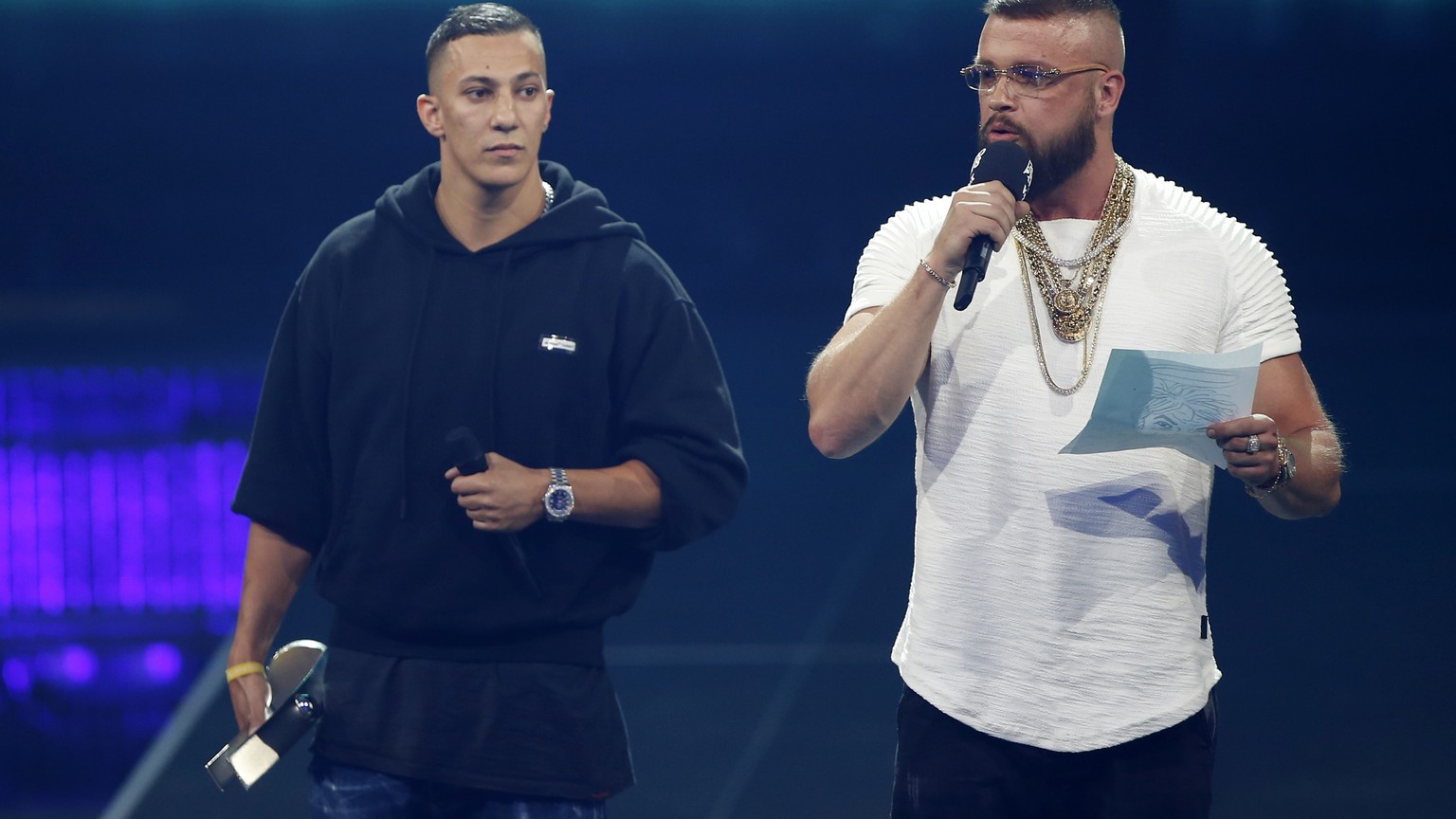 In this April 12, 2018 photo German rappers Kollegah &amp; Farid Bang receive the &quot;Hip-Hop/Urban national&quot; award during the 2018 Echo Music Awards ceremony in Berlin. A German Jewish leader  ...