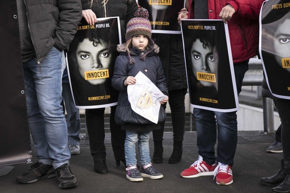 epa07424167 Fans of Michael Jackson demonstrate in front of the building of the Dutch television station NPO, against the broadcast of the documentary Leaving Neverland, in Hilversum, The Netherlands, ...