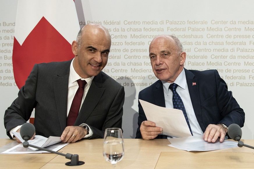 epa07584719 Swiss Federal President Ueli Maurer, (R), and Interior Minister Alain Berset speak to the press in Bern, Switzerland, 19 May 2019, after Switzerland voted on the adoption of the EU gun law ...