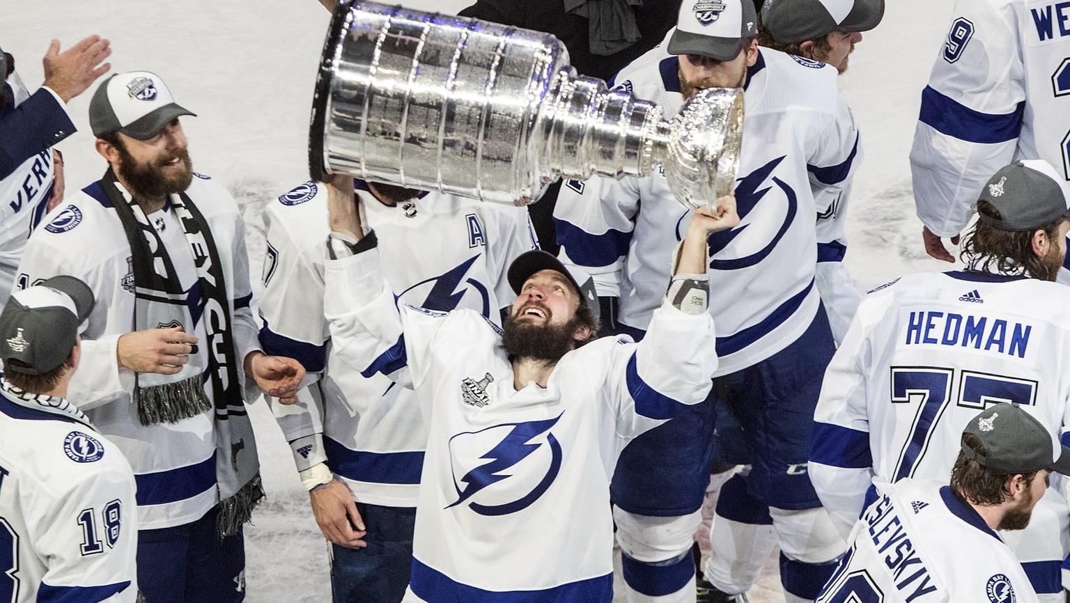 FILE - In this Sept. 28, 2020, file photo, Tampa Bay Lightning&#039;s Nikita Kucherov (86) hoists the Stanley Cup after defeating the Dallas Stars in the NHL Stanley Cup hockey finals in Edmonton, Alb ...