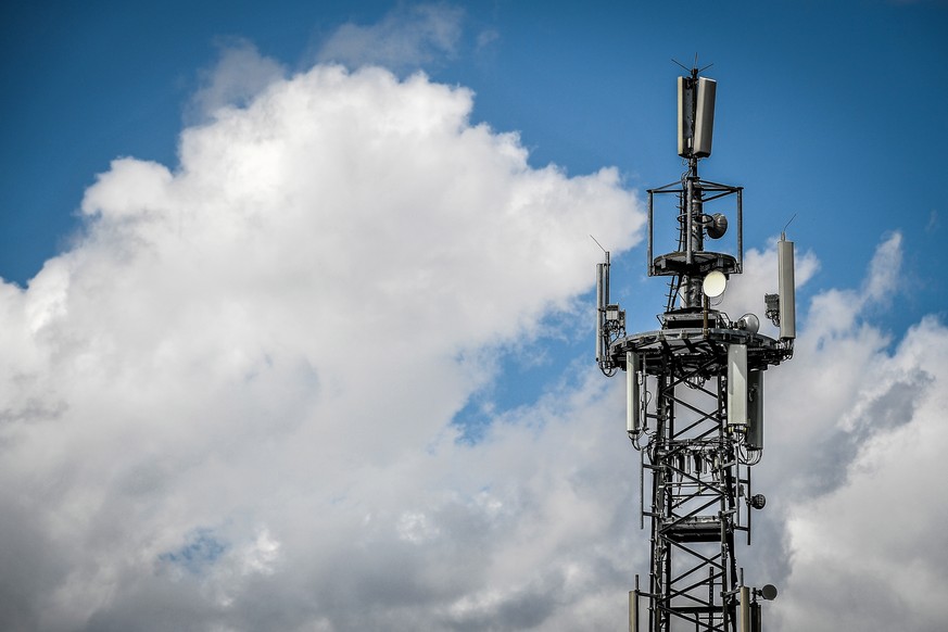 epa07762097 A mobile phone mast surrounded by dark clouds in Krefeld, Germany, 08 August 2019. Measured in terms of coverage with the LTE (4G) mobile communications standard, Germany lags far behind m ...