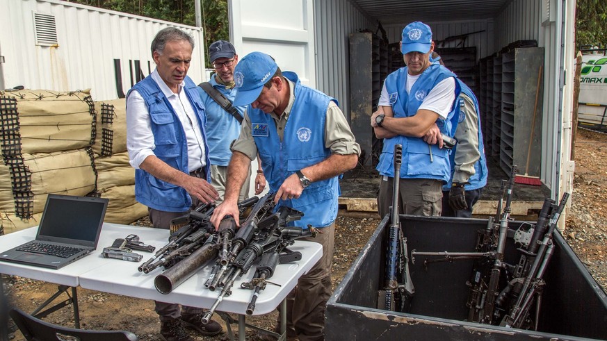 epa06026973 A handout photo made available by the Revolutionary Armed Forces of Colombia (FARC) shows Chief of United Nations Mission in Colombia Jean Arnault (L) and other UN members during an inspec ...