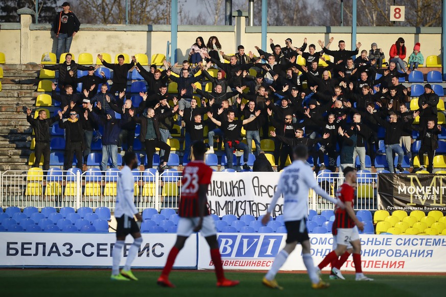 FILE In this file photo taken on Friday, March 27, 2020, fans of Torpedo Zhodino cheer during the Belarus Championship soccer match between Torpedo-BelAZ Zhodino and Belshina Bobruisk in the town of Z ...