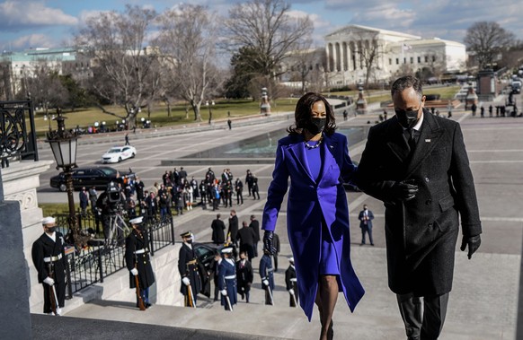 Vice President Kamala Harris and her husband, second gentleman Doug Emhoff, ascend the Capitol steps following the 59th Presidential Inauguration in Washington, Wednesday, Jan. 20, 2021. Joe Biden was ...