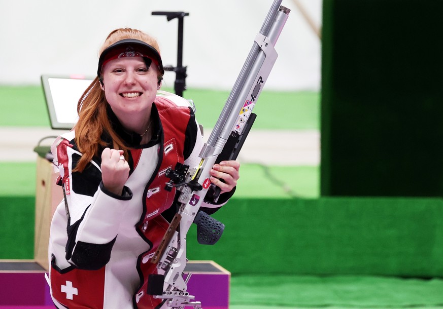 epa09360668 Third placed Nina Christen of Switzerland celebrates at the end of the 10m Air Rifle Women&#039;s Final of the Shooting events of the Tokyo 2020 Olympic Games at the Camp Asaka in Nerima,  ...