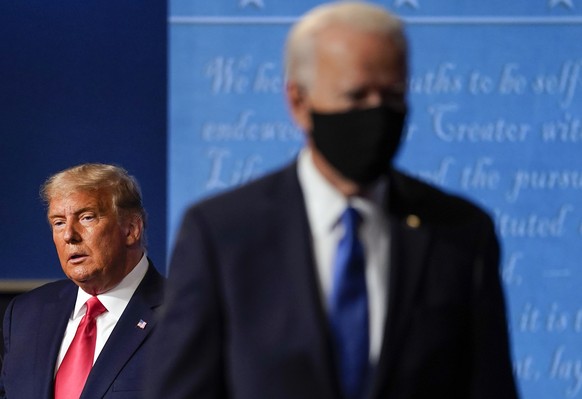 FILE - President Donald Trump, left, remains on stage as then-Democratic presidential candidate former Vice President Joe Biden, right, walks away Thursday, Oct. 22, 2020, at Belmont University in Nas ...