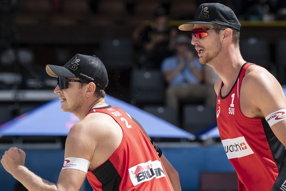 Switzerland�s Mirco Gerson, left, and Adrian Heidrich react during the Beachvolley Worldtour Major Series, on Friday, July 9, 2021 in Gstaad, Switzerland. (KEYSTONE/Peter Schneider)