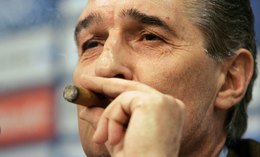 FC Schalke 04 manager Rudi Assauer smokes a cigar as he talks to the media during a press conference ahead of his team&#039;s UEFA Cup soccer match against Espanyol Barcelona from Spain in Gelsenkirch ...