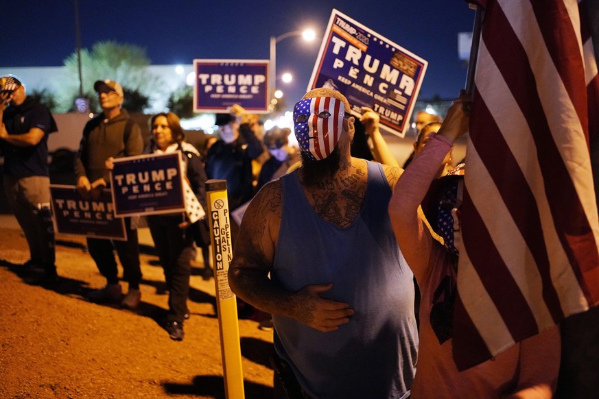 Supporters of President Donald Trump protest the Nevada vote in front of the Clark County Election Department, Wednesday, Nov. 4, 2020, in Las Vegas. (AP Photo/John Locher)