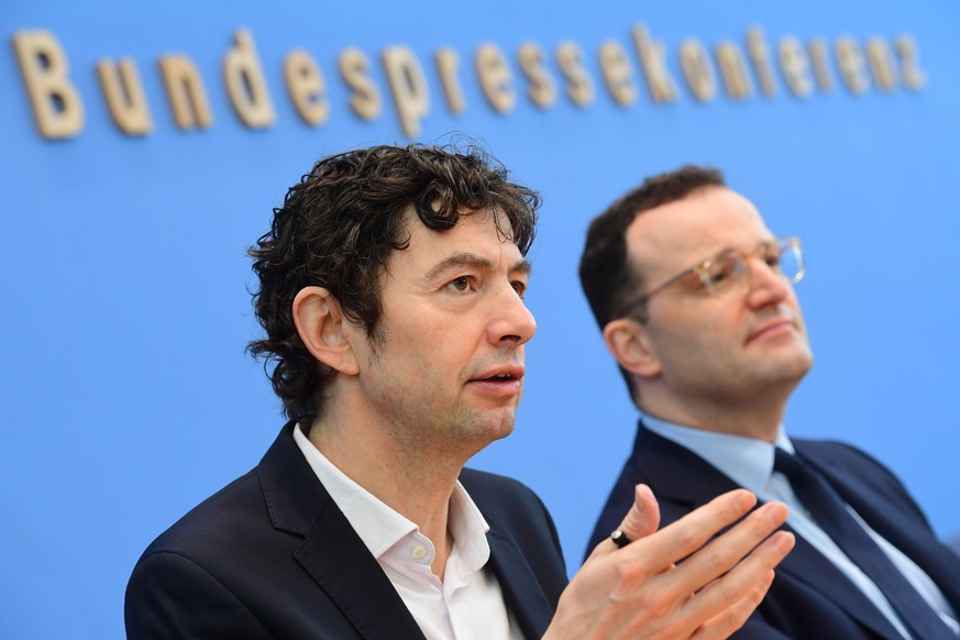 epa08264213 Director Institute of Virology of the Charite Berlin Christian Drosten (L) speaks next to German Health Minister Jens Spahn during a press conference on the handling of the coronavirus in  ...