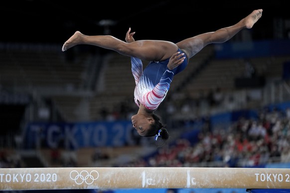 Simone Biles, of the United States, performs on the balance beam during the artistic gymnastics women&#039;s apparatus final at the 2020 Summer Olympics, Tuesday, Aug. 3, 2021, in Tokyo, Japan. (AP Ph ...