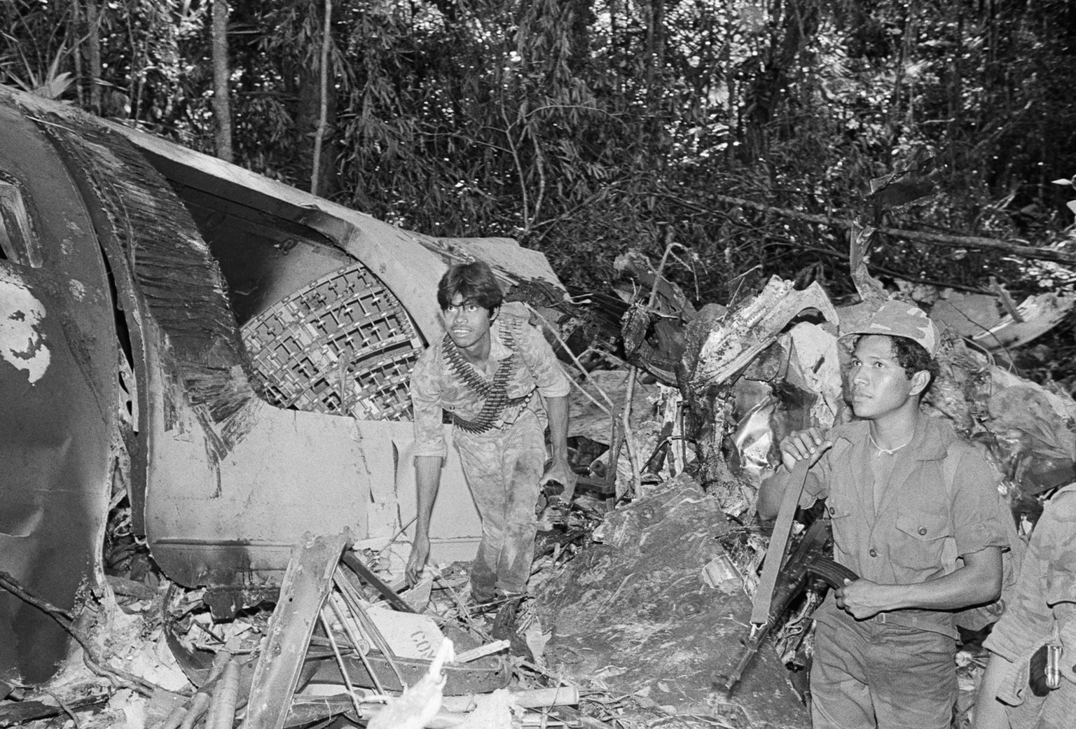 Wreckage of the rebel supply plane shot down on Saturday, Jan. 24, 1988 over Nicaragua lies in a jungle-covered area near the village of El Arenla. The plane was shot down by Sandinista forces after i ...