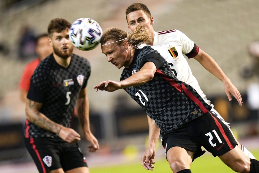 Croatia&#039;s Domagoj Vida, center, is chased by Belgium&#039;s Thorgan Hazard, right, during the international friendly soccer match between Belgium and Croatia at King Baudouin stadium in Brussels, ...