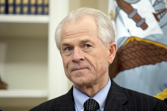 FILE - In this March 31, 2017, file photo, National Trade Council adviser Peter Navarro waits for President Donald Trump for an event in the Oval Office at the White House. Navarro signed on with the  ...