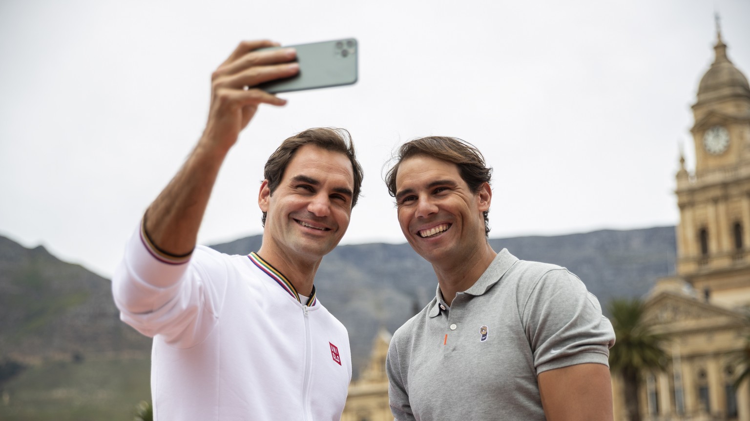 epaselect epa08199947 Roger Federer of Switzerland (L) and Rafael Nadal of Spain (R) take a selfie after playing mini tennis on the Cape Town Grand Parade infront of the City Hall and Table Mountain a ...