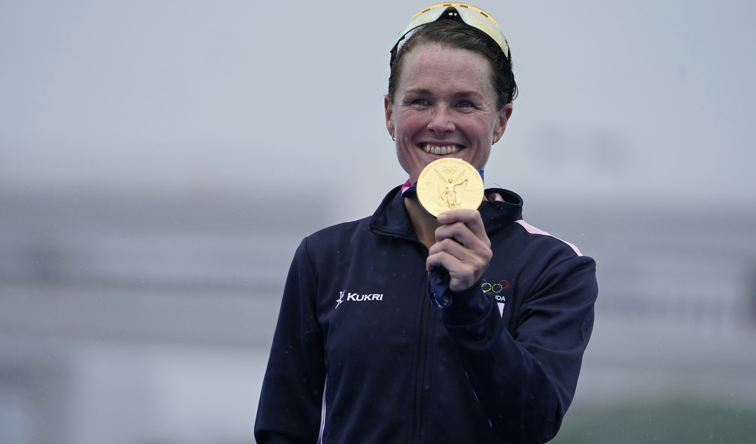 Flora Duffy of Bermuda holds her gold medal during a medal ceremony for the women&#039;s individual triathlon competition at the 2020 Summer Olympics, Tuesday, July 27, 2021, in Tokyo, Japan. (AP Phot ...