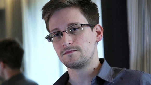 This photo provided by The Guardian Newspaper in London shows Edward Snowden, who worked as a contract employee at the National Security Agency, on Sunday, June 9, 2013, in Hong Kong. USIS, the compan ...