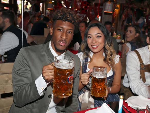 epa07901203 Bayern Munich&#039;s Kingsley Coman (L) and his wife Sephora pose as they attend the Oktoberfest beer festival in Munich, Germany, 06 October 2019. EPA/STEFAN MATZKE / POOL