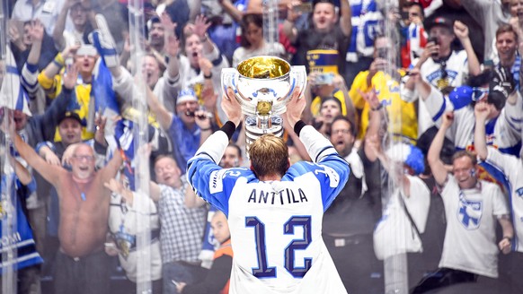epa07604299 Finland captain Marko Anttila celebrates with the trophy after winning the IIHF World Championship ice hockey final between Canada and Finland at the Ondrej Nepela Arena in Bratislava, Slo ...