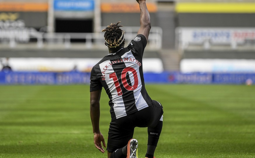 Newcastle&#039;s Allan Saint-Maximin takes a knee as he celebrates his goal during the English Premier League soccer match between Newcastle United and Sheffield United at St James&#039; Park stadium  ...