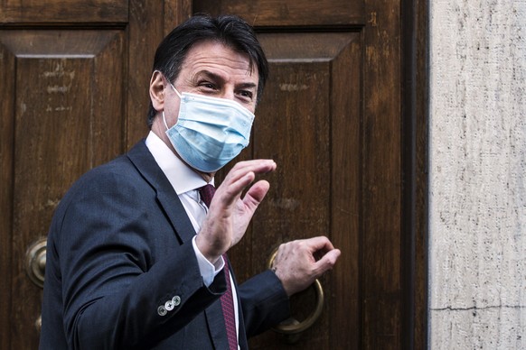 epa08991509 Former Italian Prime Minister Giuseppe Conte leaves Montecitorio after a meeting with premier-designate Mario Draghi for the formation of a new government, in Rome, Italy, 06 February 2021 ...