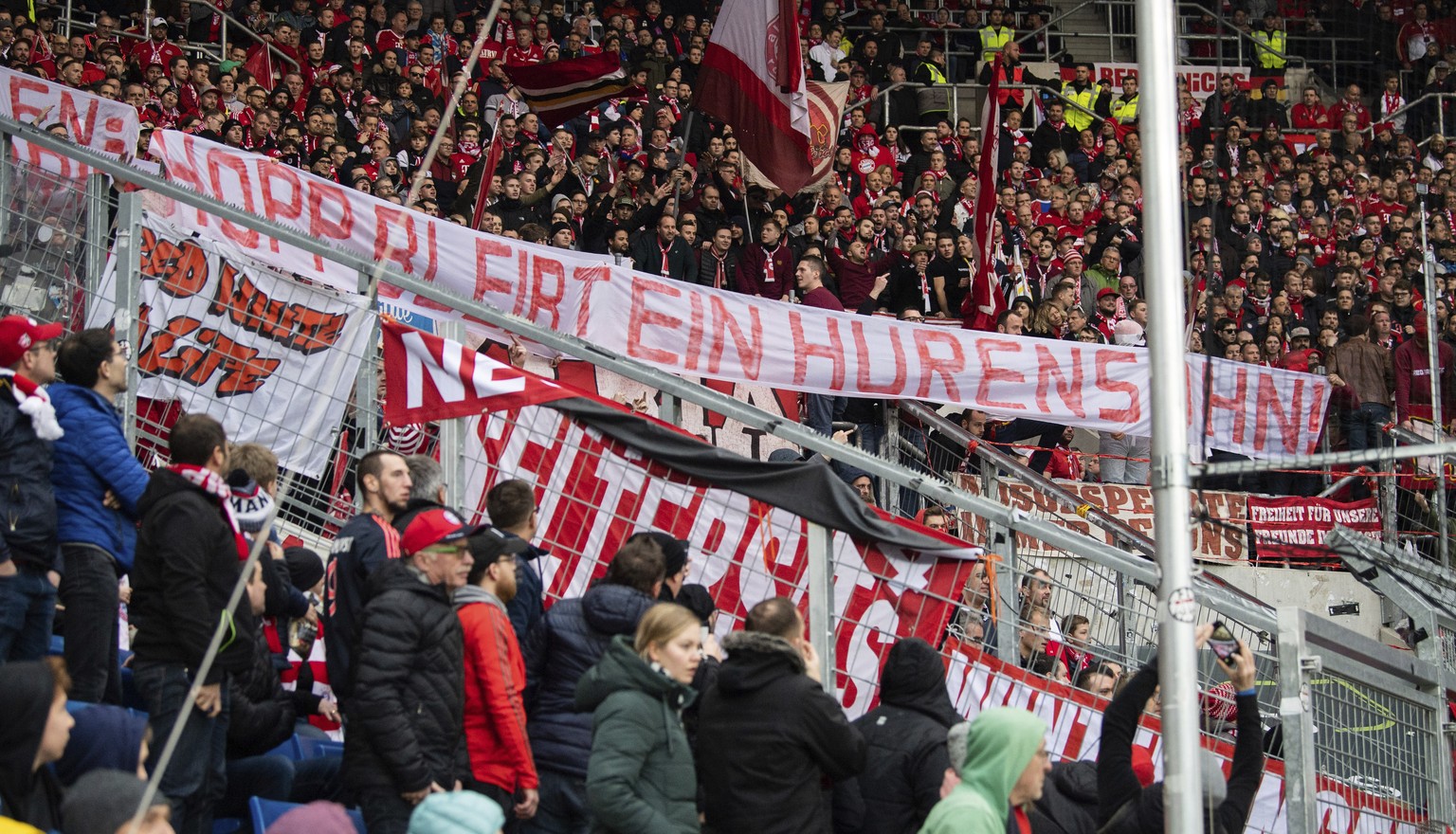 Bayern Munich supporters lift a banner reading &#039;Hopp remain a son of a bitch&#039; against Hoffenheim club patron Dietmar Hopp during the German Bundesliga soccer match between TSG Hoffenheim and ...