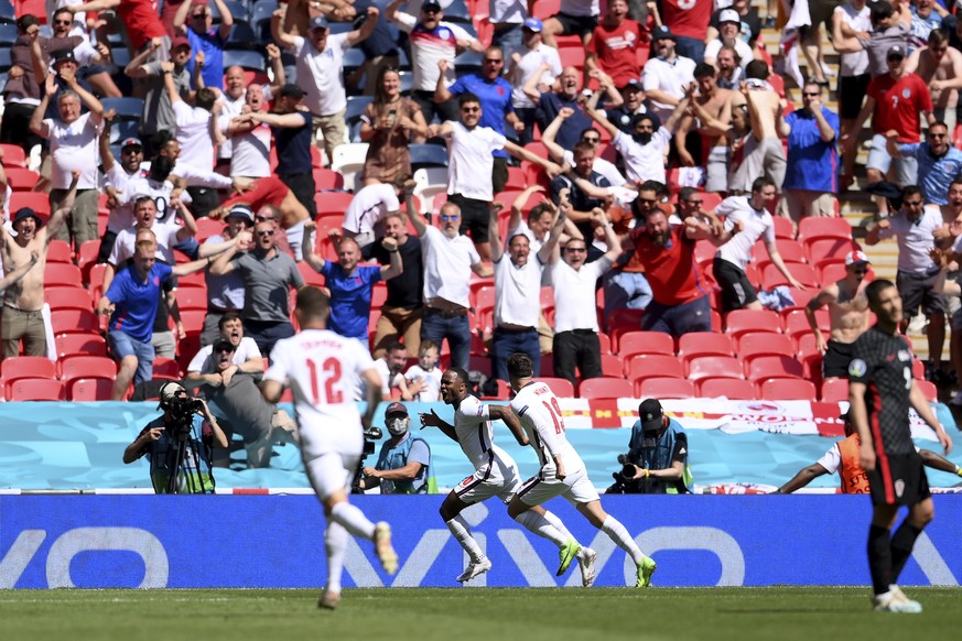 England&#039;s Raheem Sterling celebrates after scoring his side&#039;s opening goal during the Euro 2020 soccer championship group D match between England and Croatia, at Wembley stadium, London, Sun ...