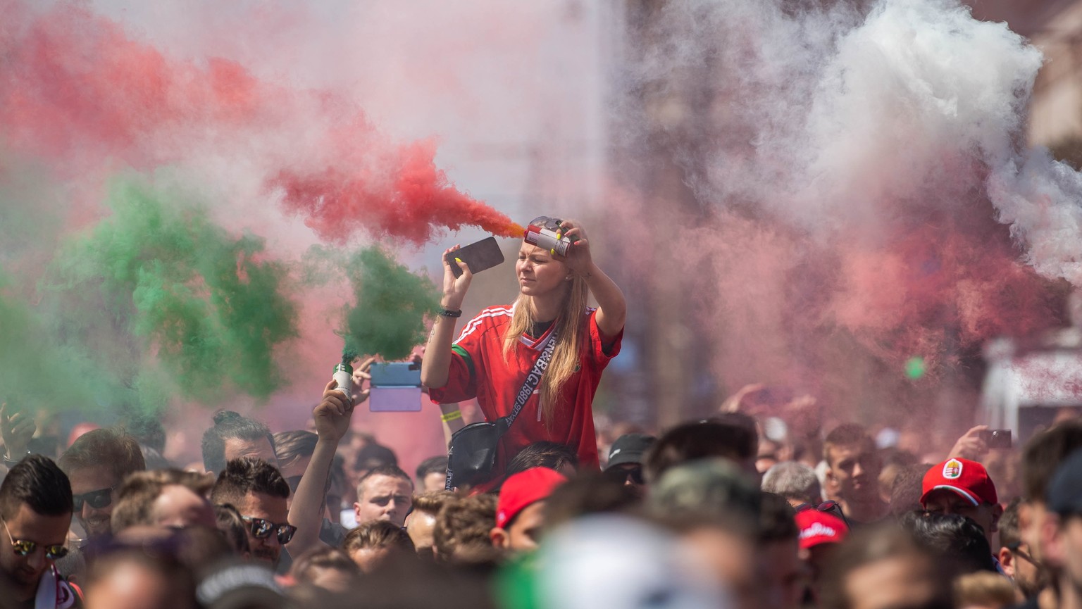 Hungarian fans march towards the Puskas Arena in Budapest, Hungary, Tuesday, June 15, 2021 hours before Hungary will face Portugal in their UEFA EURO 2020 group F preliminary round soccer match. (Zolt ...