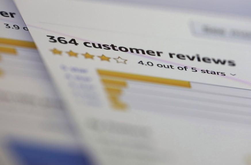 FILE - In this April 17, 2019, file photo online customer reviews for a product are displayed on a computer in New York. U.K. regulators are investigating Google and Amazon over concerns the online gi ...