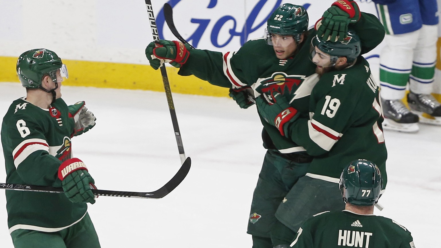 Minnesota Wild&#039;s Kevin Fiala, top left, is congratulated by teammates after his power-play goal against the Vancouver Canucks during the first period of an NHL hockey game Thursday, Feb. 6, 2020, ...