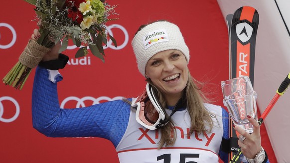 Manuela Moelgg, of Italy, celebrates on the podium after finishing third place in the women&#039;s FIS Alpine Skiing World Cup giant slalom race, Saturday, Nov. 25, 2017, in Killington, Vt. (AP Photo/ ...