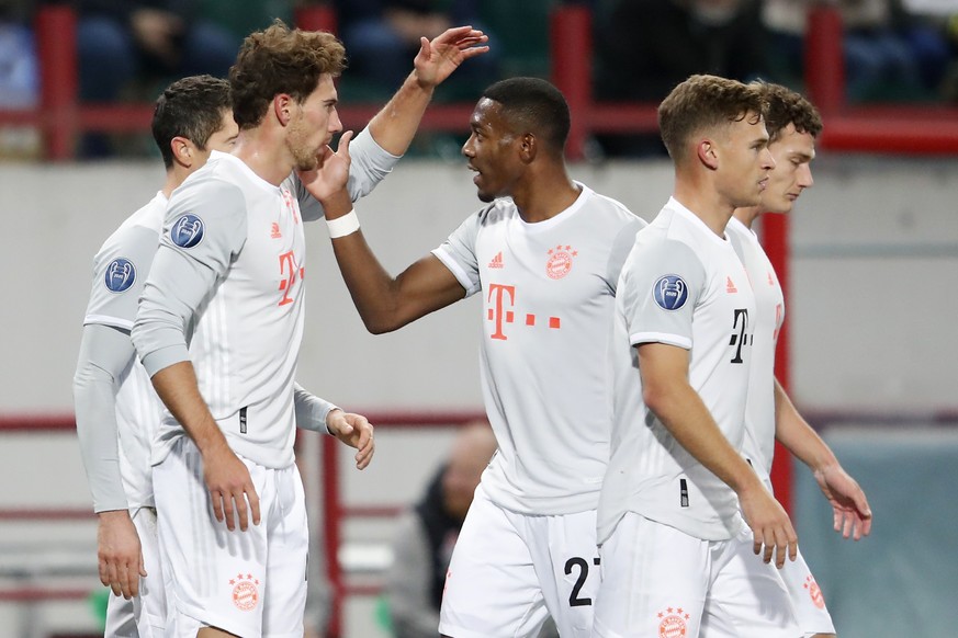 Bayern&#039;s Leon Goretzka, left, celebrates with team mate David Alaba after scoring his side&#039;s opening goal during the Champions League group A soccer match between Lokomotiv Moscow and Bayern ...